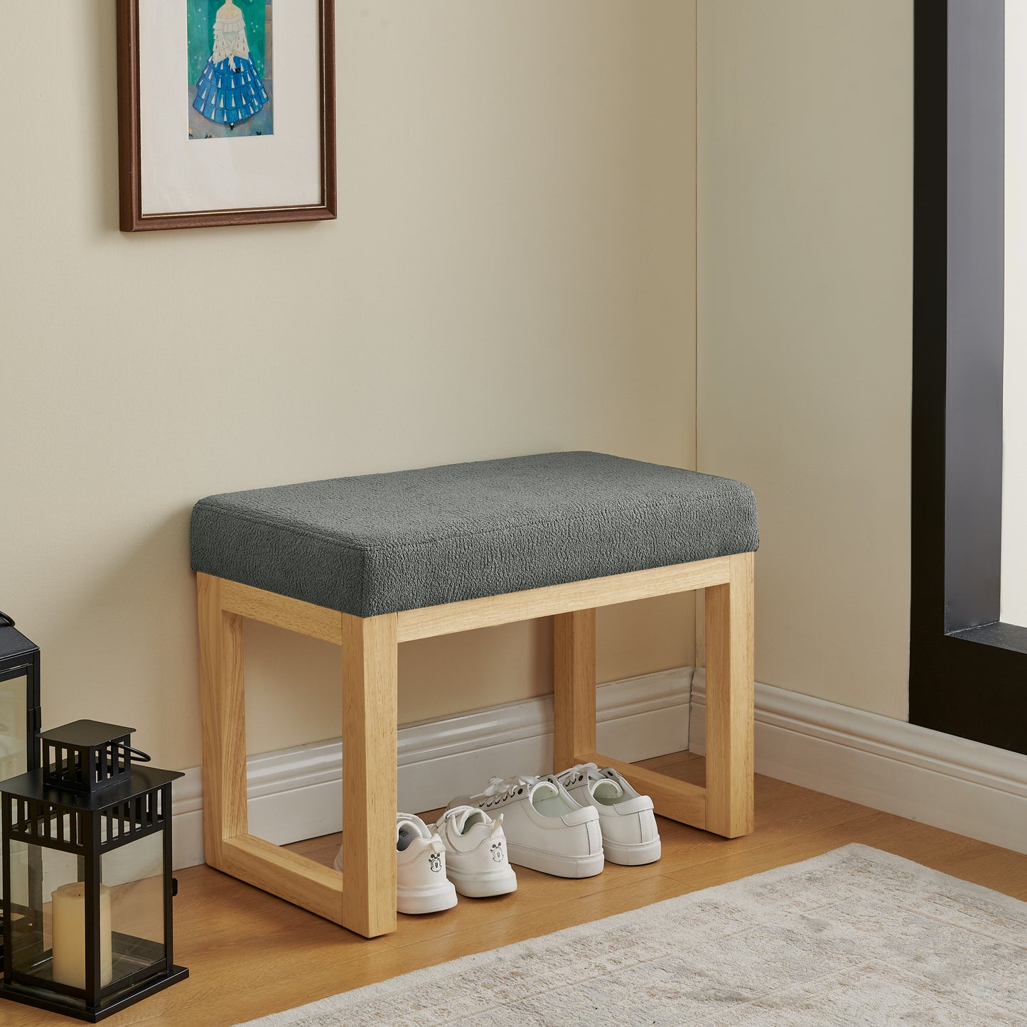 Shoe-changing bench with wooden frame and soft cushioned seat for small spaces